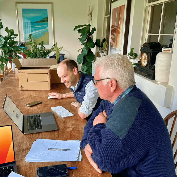 Ruminati's Rowan Winsemius demonstrates the use of the Ruminati platform to a dairy producer.