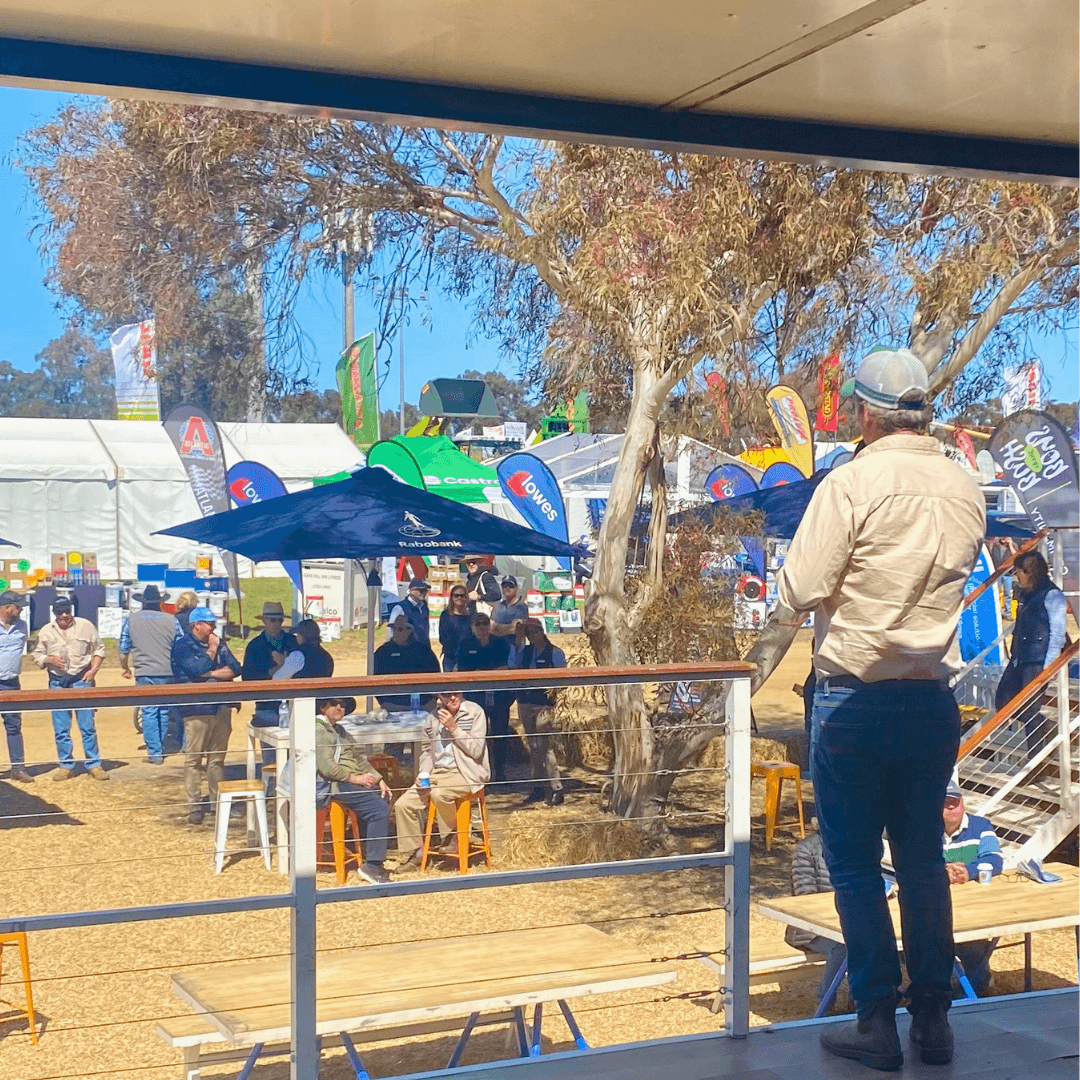 Ruminati CEO Bobby Miller speaks to the crowd about farm emissions at the Henty Machinery Field Days from the Rabobank truck.